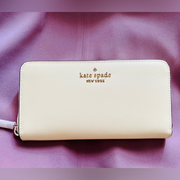 kate spade Handbags - Kate Spade Continential Wallet, Lemon Fondant, White lining NWT